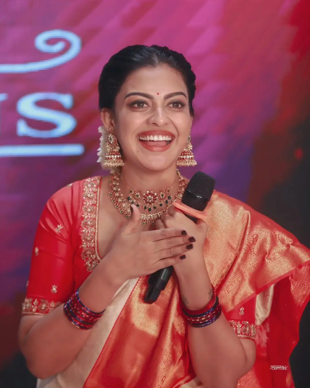 Anusree Nair Wearing Beautiful Earrings Jewellery White Saree Orange Blouse